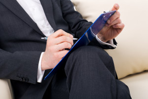 male psychologist  being ready to take notes
